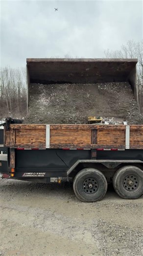 Overloaded 6x12 dump trailer with gravel