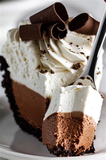The Best French Silk Pie! 🍫✨ This decadent pie features a rich chocolate cookie crust, a cloud-like, intensely chocolatey silk filling, and a generous topping of fluffy whipped cream and elegant chocolate curls. It's an unbelievably smooth, melt-in-your-mouth dessert that's perfect for any special occasion or a luxurious treat! #FrenchSilkPie #ChocolatePie #SilkPie #HomemadePie #DecadentDessert #ChocolateLover #WhippedCream #ChocolateCurls #ClassicDessert #BakingLove #SweetTreats #DessertRecipe
