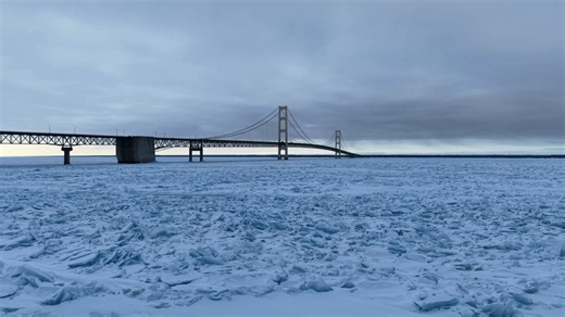 Aerial Footage Shows Michigan Bridge Tower Over Icy Lake