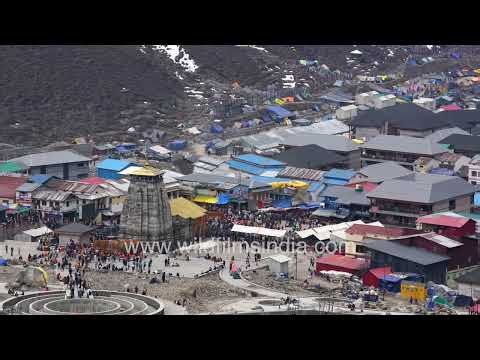 Kedarnath Temple and pilgrim settlement amid snow-covered Himalayan mountains in Uttarakhand