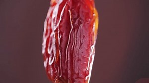 Fresh dates fruits close up on kitchen, close up in supermarket. Eating dried fruits. Vegan, vegetarian food.