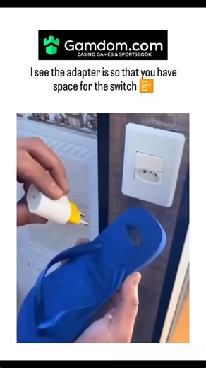 Briefly Explaining on Instagram: "#The X post features a DIY hack gluing a blue flip-flop to a US-style plug adapter, extending it to allow access to a European wall switch without unplugging devices. Posted by South African user @pmcafrica on December 11, 2025, it highlights resourceful improvisation for common outlet frustrations, amassing 1.4 million views and mixed replies including laughs and spam ads. This low-cost fix echoes global trends in household hacks, though safety concerns like fi