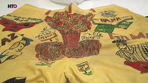 Collections Manager Hilary Fleck shows off some the senior cords in the center's collection. | The Herald-Times | Facebook