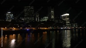 Boston city skyline, city at night reflection on the harbor water Boston, city, capital of the commonwealth of Massachusetts, and seat of Suffolk county, in the northeastern United States.
