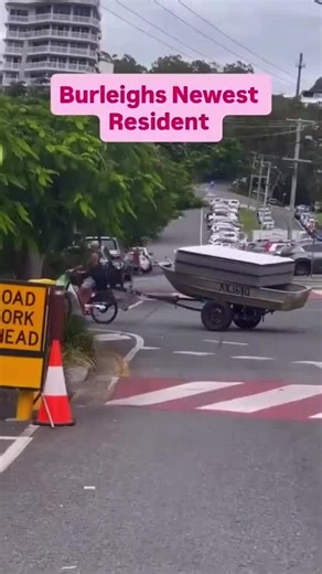 Man tows boat and mattress using Lime Bike