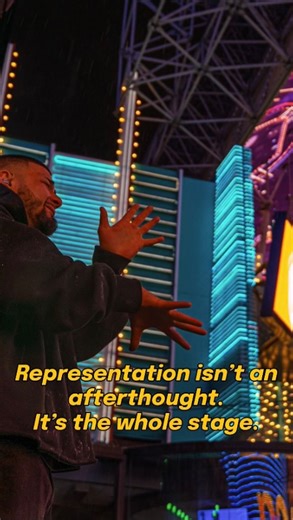 Lagundo Sandoval | CODA on Instagram: "📍Las Vegas, Fremont Street Experience – NYE 2025 → 2026 Something unforgettable just happened. Visual Description: Lagundo performs in Las Vegas on NYE 2025→2026. He signs live onstage beside legendary Pacific Islander reggae artists. The rain falls heavy. The city lights glow. His black hoodie reads “PURPLE.” The crowd is packed with Deaf and hearing and the energy is electric. In front of a sea of people, under the lights, in the pouring rain, I had the 