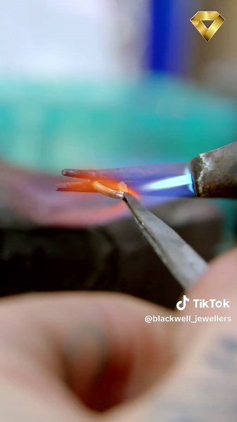 Watch this jewelry artist bring tiny metal dreams to life. Precision, fire, and pure skill. #JewelryMaking #Artisan #Metalsmith #HandmadeJewelry #Craftsmanship