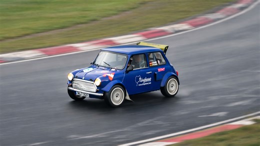 Classic Mini pushing hard in slippery Nürburgring conditions