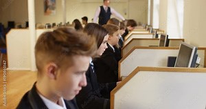4k, Group of teenage school kids in a computer lab.