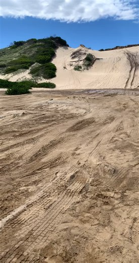 Off-Road Adventure: Red SUV Climbing Sand Dune