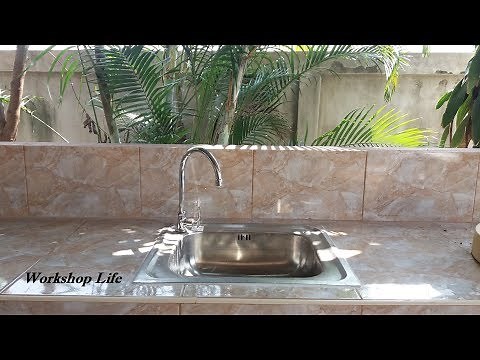 Installing a sink in my outdoor kitchen.