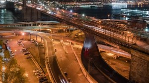 Timelapse tilt reveal unique view of Brooklyn Bridge traffic FDR Drive.