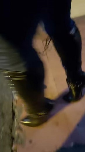 My extreme heel boots in the street.