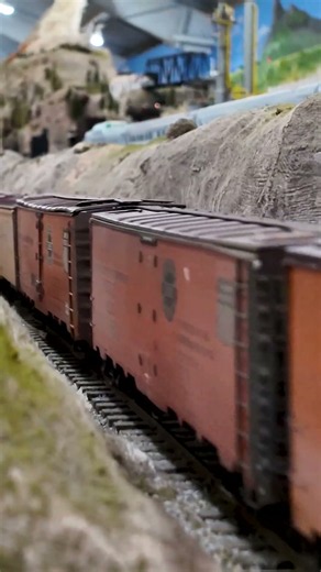 Southern Pacific F Units haul a reefer train around our O scale layout at GSMRM