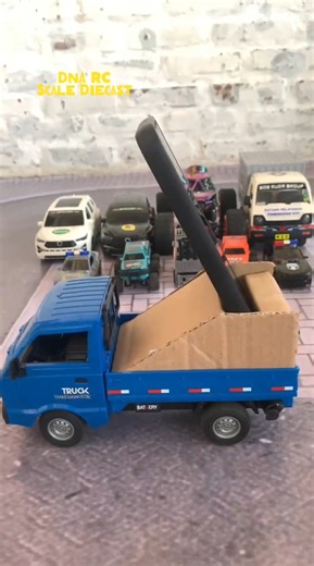 Monster truck, Innova car, and forklift looking at the camera on top of a pickup truck #rccars #a...