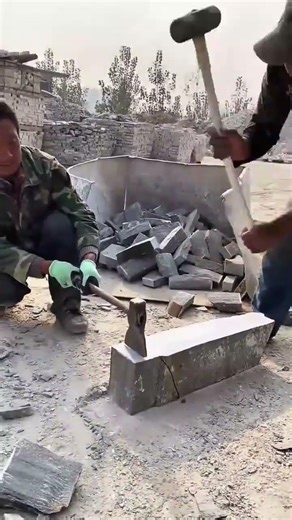 Splitting Large Concrete Blocks into Smaller Bricks Using a Handheld Axe and Sledgehammer