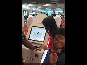 Self check-in luggage dropping by kiosk at Changi International airport, Singapore