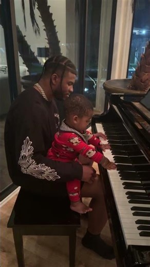Shilo teaching Snow how to play the piano.