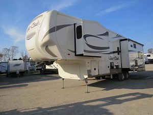 This New 2018 Forest River Cedar Creek Silverback 29IK Fifth Wheel is modern luxury and design at its best! Save over $22,000 today! Unit features 48” LED TV in living room, maple hardwood cabinet doors, electric fireplace, La-Z-Boy sofa recliners, Dirt Devil central vacuum system, and so much more. For pricing and addition information click here -> https://goo.gl/4kaYw7 | Crossroads Trailer Sales