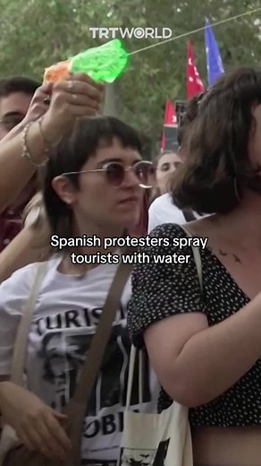Protesters in Barcelona Spray Tourists in Social Issues Protest | Barcelona Spain Tourism