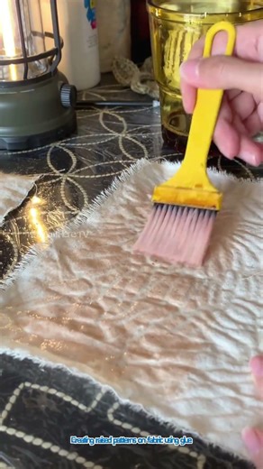 Creating raised patterns on fabric using glue