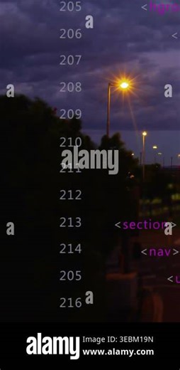 Vertical video: Numeric column scrolling upward on magenta tag cue, showing code and traffic. Streetlamp, urban, dusk, cityscape, silhouette, headlights, vertical video Stock Video Footage - Alamy