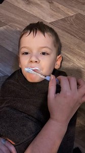 Autism and brushing teeth Over the years it has been a struggle with trying to get a toothbrush in Oliver's mouth nevermind brushing them, we have tried several different toothpastes and brushes with no effect. But as the years have gone by and with a strict routine of brushing his teeth right after a bath along with row row row your boat (this helps Oliver with eye contact and helps focus) we are in this position now, Oliver will lay down without asking or wrestling him.. open his mouth and sho
