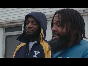 JU JILLA - IN FRONT OF THE BUILDING