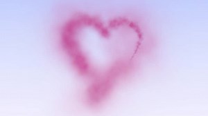 Looping Animation of a Pink Smoke Heart Sparkler on a Blue Sky