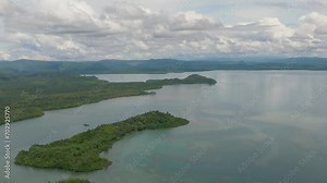 Top view of coast with rainforest and tropical islands in the bay. Borneo. Sabah, Malaysia.