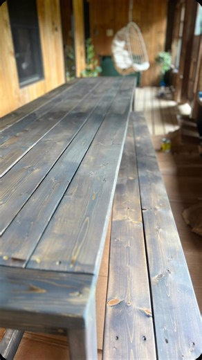 Farmhouse Table 🛠️ Building this table was one of the many projects we took on last summer on the homestead. We really wanted a long table that would fill this space perfectly. After shopping around, we decided to build it ourselves. #diy #diyproject #table #farmhouse #farmhousetable #homestead #newhampshire #newhampshirelife #inthewoods #lakewinnipesaukee #logcabin #diyprojects #buildyourown #cchomestead #cabin #cabininthewoods #dinnertable #porch #vlog | CC Homestead Life