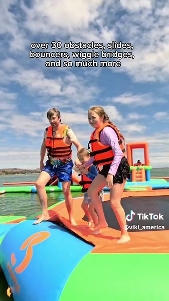 Introducing Cali Splash Park, the largest inflatable aquapark nestled on the stunning Lake Elsinore, perfectly situated between the vibrant cities of Los Angeles and San Diego. 🏊‍♀️🏄‍♂️ Gather your family and friends for an unforgettable day of laughter, thrills, and endless splashes! Their water playground boasts an impressive array of over 30 obstacles, slides, bouncers, wiggle bridges, and so much more. 🌈💦 As you conquer each challenge and slide down exhilarating pathways, you’ll be surro