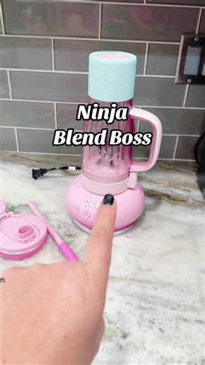 The Ninja BlendBOSS Tumbler Blender is a powerful 1200-watt personal blender that crushes ice to snow and blends smoothies directly in a 26oz travel tumbler with a leakproof lid and removable straw. Designed for busy women who want quick, smooth protein shakes without bulky blender cleanup, it features Auto-iQ programs for effortless blending. Compact, cupholder-friendly, and perfect for on-the-go mornings, this countertop blender makes healthy habits easier. #ninjablendboss #kitchenfinds #TikTo