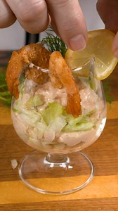 Shrimp cocktail salad in glass. Avocado with salmon on a lemon slice Shrimp dishes are a whole range of flavors and possibilities: you can cook exotic soups from them, serve them grilled with sauces or in a pan - with noodles and vegetables. Today I have an idea for you for an original salad in glasses, perfect for home parties. A simple, very tasty and effective salad decorated with tasty prawns. #recipeoftheday #recipeideas #appetizer #yummy #foodies #starter | Nat Ura