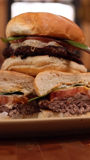 Brad Leone on Instagram: "Best ever, world famous, most perfect SMASH BURGER….on the latest episode of Makin’ It! The perfectly cooked burger only made possible thanks to pal @traegergrills ! Nice lil secret tangy spicy homemade sauce to go with it…show me your burgers! I love you ❤️ ✌️"