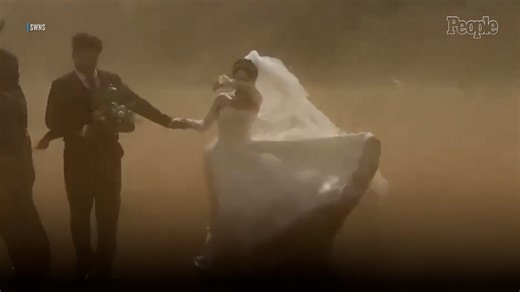 Bride and Groom Caught in Sudden Sandstorm While Taking Their Wedding Photos
