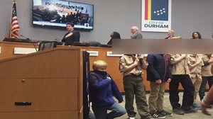 Dad explains why son took a knee during pledge of allegiance at council meeting