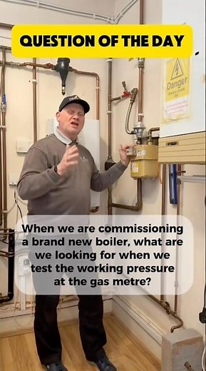 What should the working pressure be at the gas meter when commissioning a boiler.