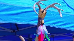 Traditional Native American dance stick is essential for rituals, symbolizing the beliefs and spirituality of Indigenous tribes. Annual Two Spirit Pow wow, by 2-Spirited People of the 1st Nations.