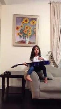 Little girl singing Imagine. Song by John Lennon