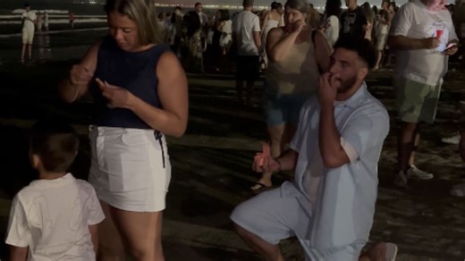 Man surprises girl with a proposal delivered like a message in a bottle
