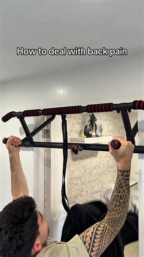 Dead hangs are a great place to begin when it comes to spinal decompression. By using gravity to gently stretch the body, they help reduce pressure on the spinal discs and relieve tension in the shoulders and upper back. However, because your grip and upper body are still doing much of the work. #spinaldecompression #backpain #lowerbackpain #posturecorrection #flexibility