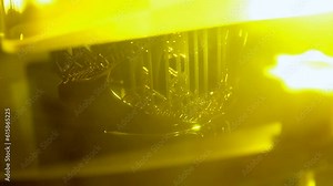 Stereolithography 3d printer. Working process 3d printer from photopolymer resins. 3D printing technology on solidification of liquid material under laser. DPL SLA 3d print UV polymerization close-up