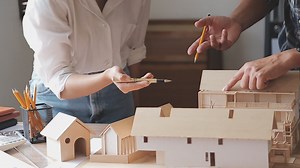 Download Construction engineer working at blueprint to build large commercial buildings in office. Engineering tools and construction concept. for free