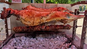 Pig roasted on a barbecue spit. Outdoor Barbecue grill a classic traditional open bbq pit