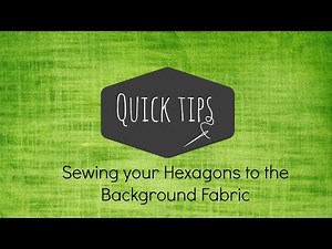 How to attach hexagons to the background fabric