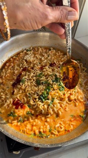 Chhaya Joshi Daily food / cocktails on Instagram: "Ramen in Spicy peanut sauce 1. One packet Ramen noodles 2. 2 tablespoons peanut butter 3. 1 - 1.5 tablespoon chili oil 4. 1 tablespoon rice vinegar 5. 1. 5 tablespoons soy sauce 6. Pinch of salt 7. 1 tablespoon green onions 8. 1 tablespoon cilantro 9. 1.5 - 2 cups noodle water 10. Garnish- chili oil 1. Cook Ramen noodles one minute shy of cook time it will cook longer in the sauce. 2. Save about 2 cups of noodle water to create the sauce base 3.