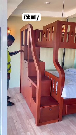 Introducing the Staircase Bunk Bed: Where storage meets fun and functionality! This cleverly designed bunk bed features a staircase with a hidden bookcase, making organization a breeze and adding an element of excitement to tidying up. Forget about Bunkie boards—our bed comes with two mattress-ready slat kits that accommodate mattresses up to 9 inches thick. Customizable to fit your style, choose from various colors and optional features like a trundle or bed drawers for added convenience. | BAC