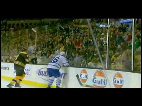 Milan Lucic hits Mike Van Ryn through the glass 10/23/08