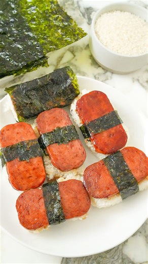 I’ve been missing Hawaii so I decided to whip up some authentic Spam Musubi at home! I highly recommend a musubi mold to make the process easier, and that savory sweet glaze over the golden browned spam is the perfect beach or pool snack! Comment “CJ Recipe” for the full recipe with all of my KEY tips sent straight to your inbox (make you follow me and your message requests are open to ensure you receive it)! @spambrand https://cjeatsrecipes.com/spam-musubi/ #cjeatsrecipes #hawaiianfood #easyrec